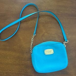 blue Michael Kors mini crossbody